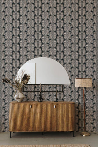 Mitchell Black Betty Palm Leaf Botanical Wallpaper in shade Black entryway at Say Decor