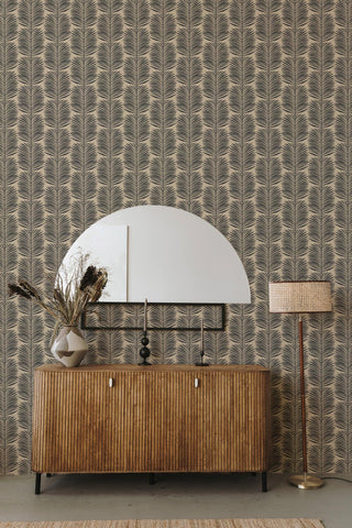 Mitchell Black Betty Palm Leaf Botanical Wallpaper in shade Camel living room at Say Decor