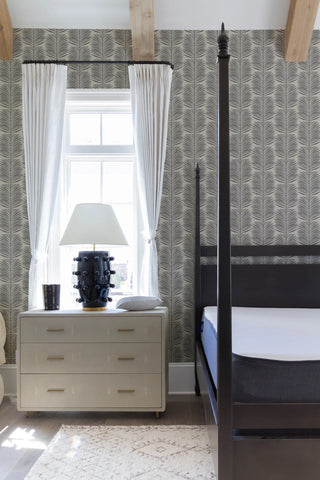 Mitchell Black Betty Palm Leaf Botanical Wallpaper in shade Cashmere bedroom at Say Decor