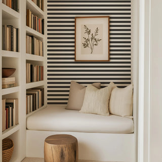 Mitchell Black Mrs. Paranjape Versa Stripe Wallpaper reading nook in shade Black at Say Decor