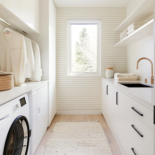 Mitchell Black Mrs. Paranjape Versa Stripe Wallpaper laundry room in shade Neutral at Say Decor