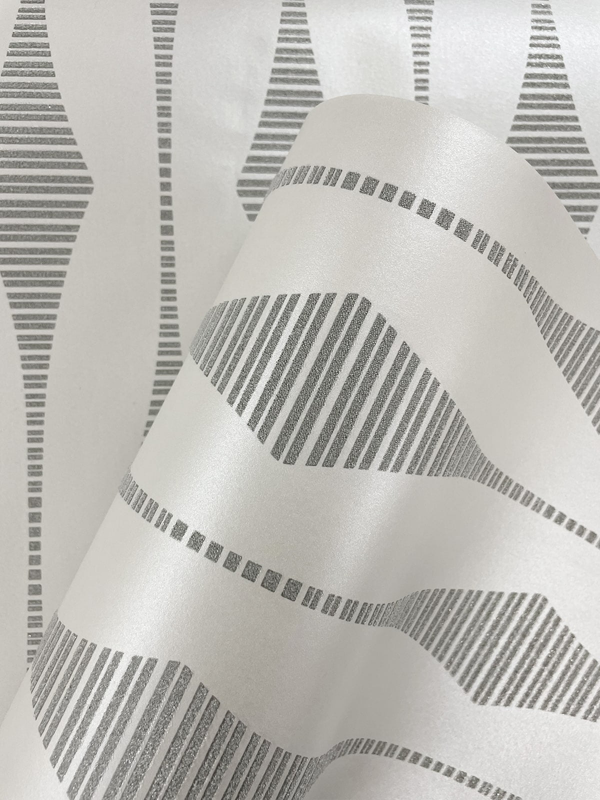 BD50600 ikat geometric glass bead wallpaper roll from Etten Studios