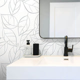 NW36508 tossed leaves botanical peel and stick removable wallpaper bathroom by NextWall
